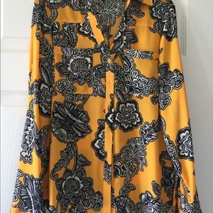 Stand OUT in this rich and vibrant dress Blouse!